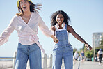 Portrait, holding hands and skate sport girl friends back on outdoor promenade with balance and skating. Woman, skate and friendship of women on summer holiday break doing a fun activity on pavement