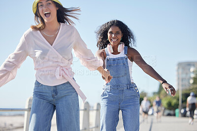 Buy stock photo Portrait, holding hands and skate sport girl friends back on outdoor promenade with balance and skating. Woman, skate and friendship of women on summer holiday break doing a fun activity on pavement