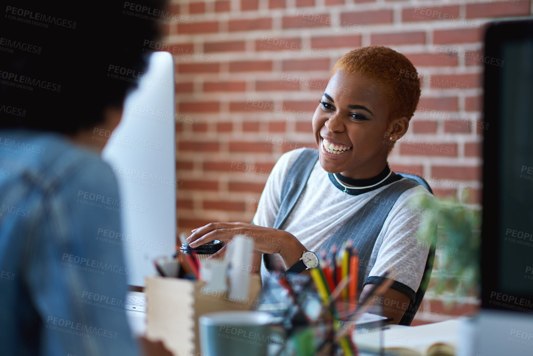 Buy stock photo Black woman, laughing and employees in creative business agency, startup and trendy company. Happy female worker smile at desk for collaboration, funny conversation and talking with friends in office