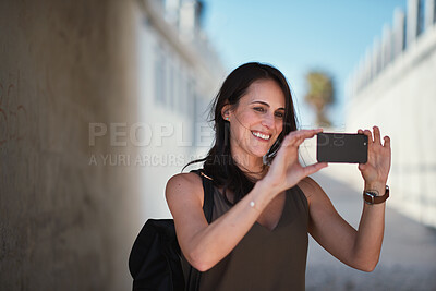 Buy stock photo Travel, selfie and woman in a city, happy and smile while sightseeing, explore and adventure. Social media, profile picture and influencer blog post by girl in town live streaming to online followers