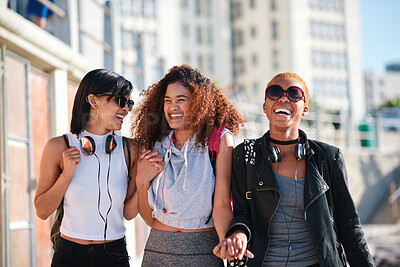 Buy stock photo Women friends, holding hands and walk in city with smile, support or happiness for summer travel together. Black woman students, laughing and comic joke with excited face, happy and group vacation