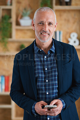 Buy stock photo Senior businessman, portrait and texting in office, startup and smile for vision, success and goals. Elderly executive, smartphone and happiness in workplace with communication, networking and chat