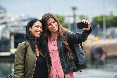 Buy stock photo Selfie, travel and diversity with tourist friends taking a picture outdoor together in a foreign city abroad. Happy, smile or bonding with a female and friend posing for a photograph overseas