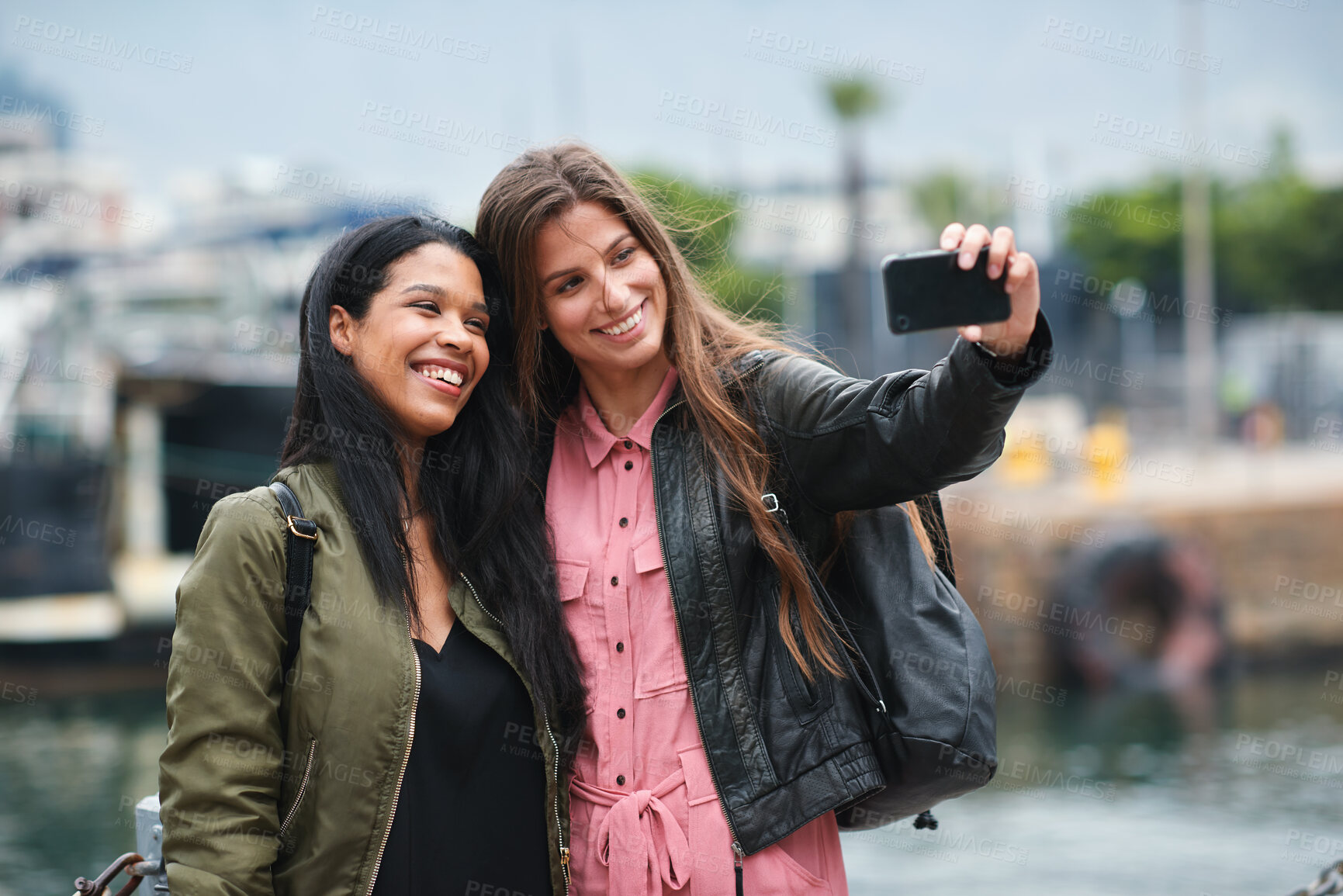 Buy stock photo Selfie, travel and diversity with tourist friends taking a picture outdoor together in a foreign city abroad. Happy, smile or bonding with a female and friend posing for a photograph overseas