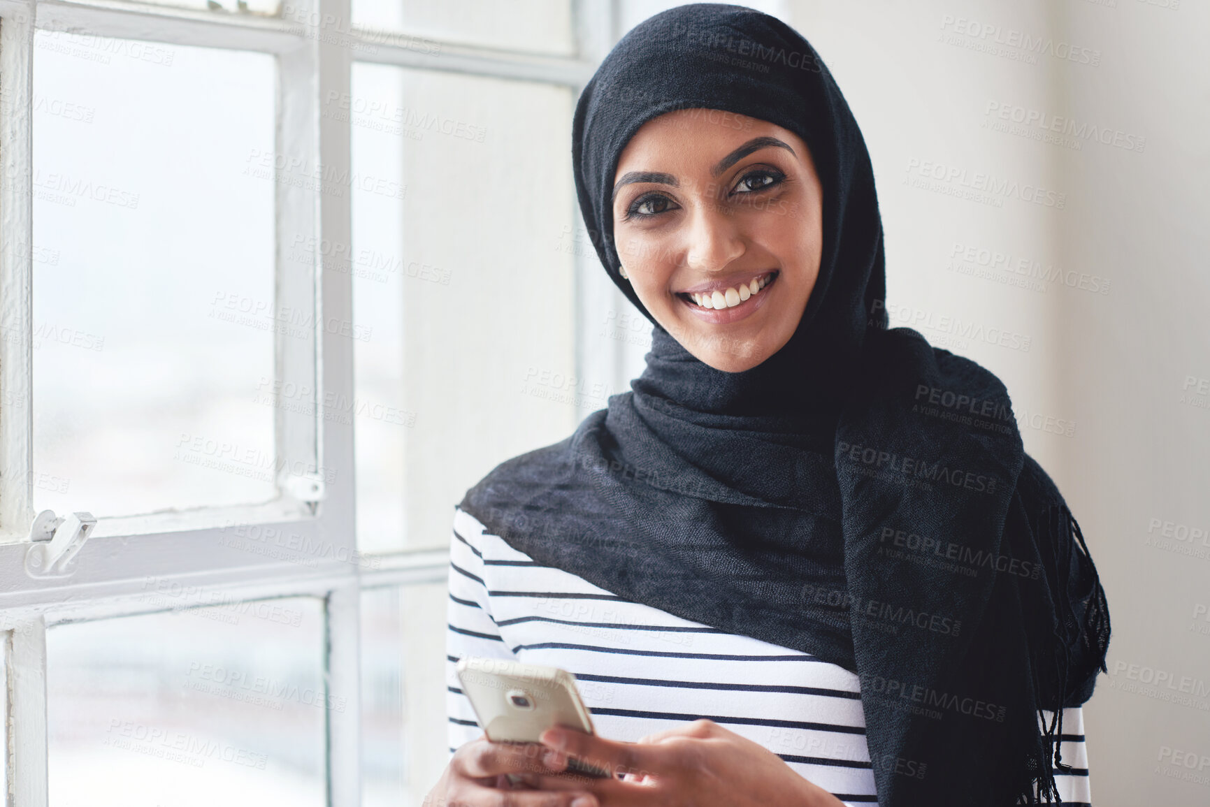 Buy stock photo Creative muslim woman, phone and face smile for social media, communication or texting in startup at the office. Portrait of happy islamic girl smiling for online conversation on mobile smartphone