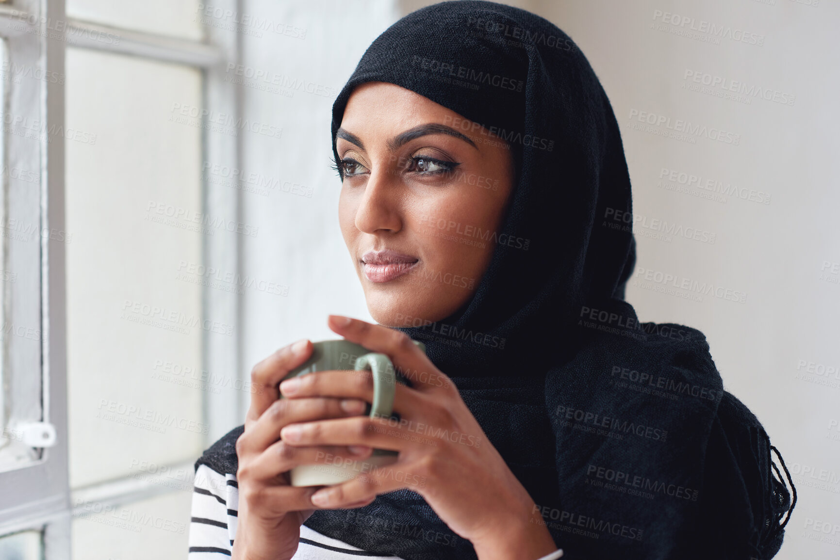 Buy stock photo Window, thinking and Islamic woman with coffee, peace and calm in home, daydreaming and thoughts. Muslim female, hijab and lady with tea, staring outside and ideas for fantasy, future and wondering
