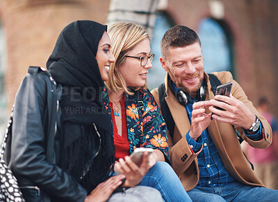 Buy stock photo Friends, diversity and happy people with phone communication and funny meme. Hijab, muslim and talking women and adult learning group and international student community on college steps