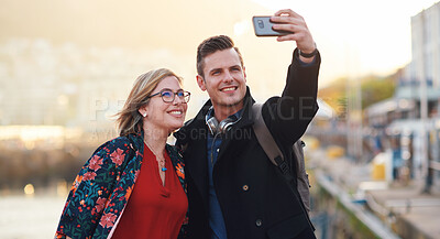 Buy stock photo Selfie, travel and couple with phone by harbor enjoying vacation, holiday and honeymoon in Amsterdam. Journey, adventure and happy people take picture for social media, post and memory on smartphone