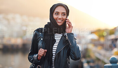 Buy stock photo Phone call, muslim and woman talking in city, chatting or speaking to contact outdoors. Dubai, thinking and happy female with 5g mobile for networking, conversation or discussion in town at sunset.