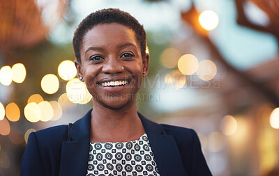 Buy stock photo Smile, confident black woman and portrait in a city with bokeh, lights and blurred background space. Face, traveller and happy African American person in town for fun, break or trip on the weekend