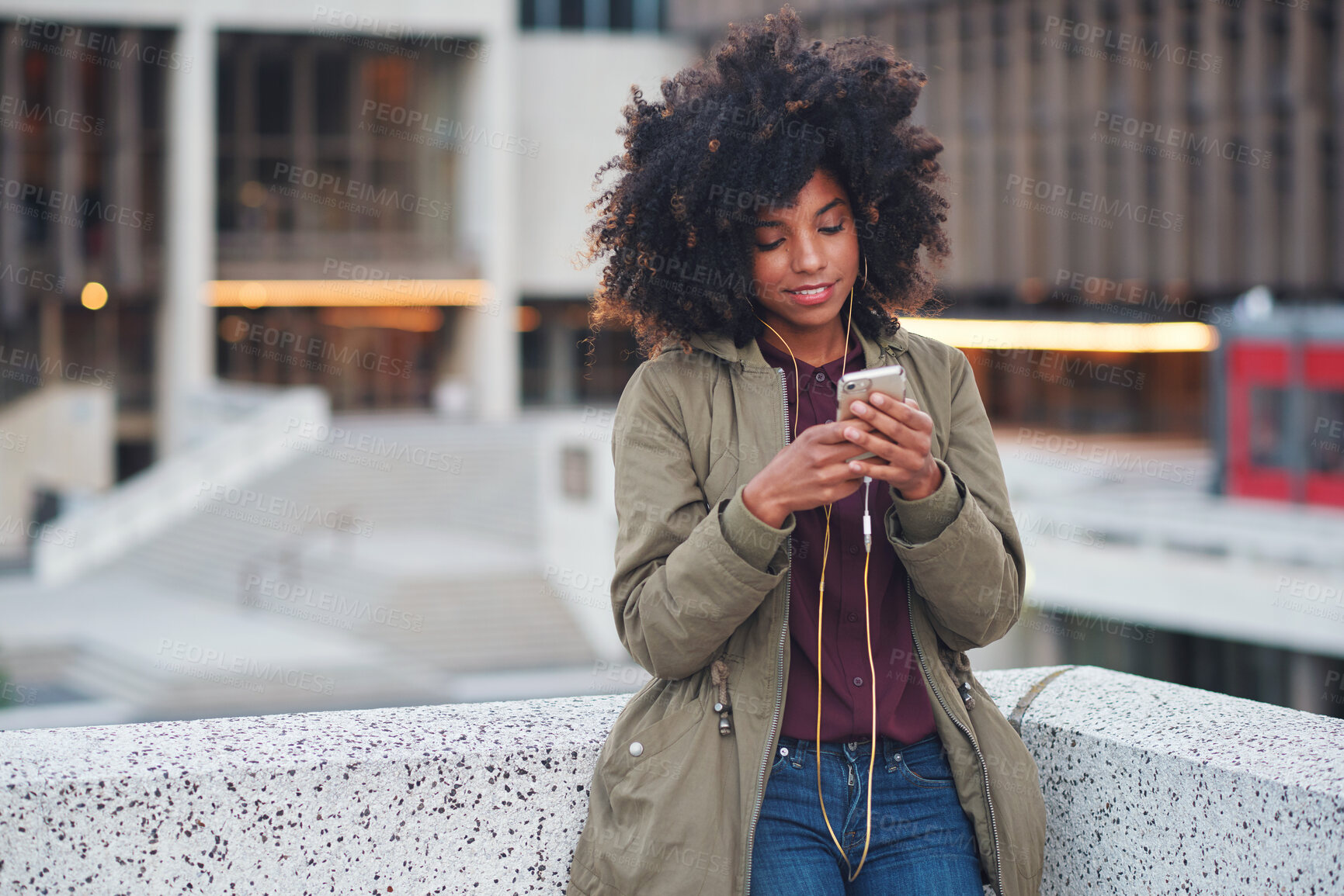 Buy stock photo Black woman, city and texting with afro, smartphone ux and reading for social network chat. Urban gen z girl, african and phone for blog, post and networking on dating app on rooftop balcony in metro