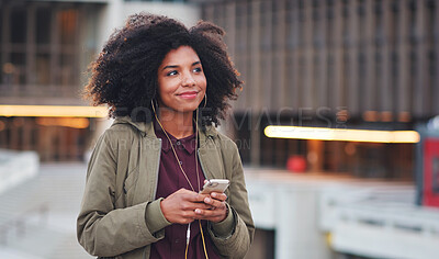 Buy stock photo Music, travel and phone with black woman in city for streaming, happy and social media. Technology, afro and smile with girl walking and listening to earphones for mobile radio, network or podcast