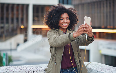 Buy stock photo Black woman, city and selfie with smile, smartphone and happiness for social media profile picture. Happy gen z girl, african and phone for blog, post or networking app on rooftop balcony for travel