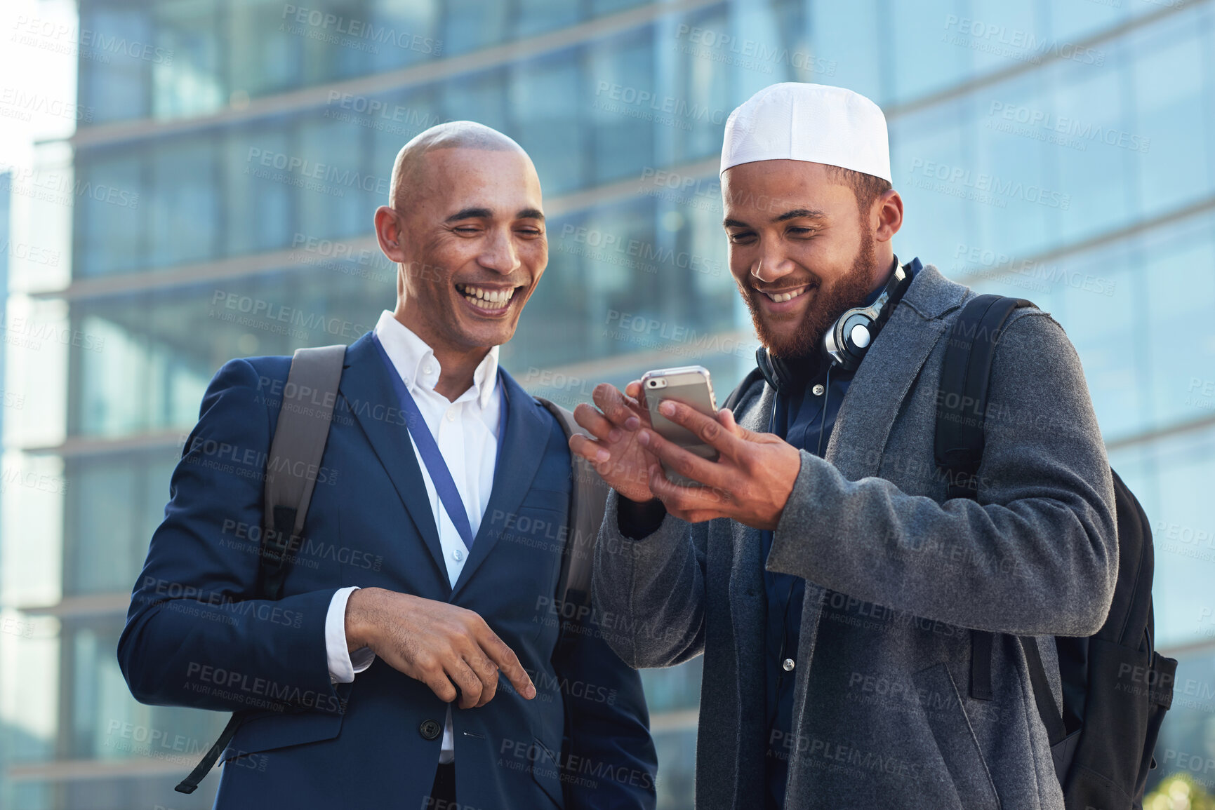 Buy stock photo Phone, city and diversity business men for global networking, social media update and corporate collaboration. Happy black man with Arab, muslim or islamic partner on smartphone of international chat
