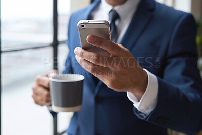 Buy stock photo Email, coffee and hand of a businessman with a phone for social media, communication and chat. Contact, internet and employee reading the news on a mobile app while drinking tea in the morning
