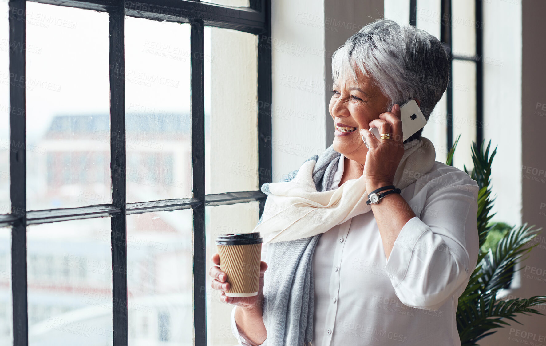 Buy stock photo Phone call, window and coffee with a business woman at work in her office for communication or networking. Mobile, contact or view and a senior female employee talking while working with a view