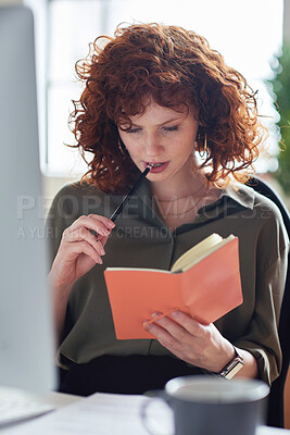Buy stock photo Thinking, planning or graphic designer woman reading notebook for creative research, web strategy or branding. Startup office or serious girl employee at desk working on SEO report, notes or journal