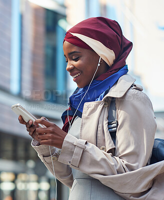 Buy stock photo Phone, black woman travel or music in city on headphones for social media, motivation or mindset. Happy student girl on smartphone radio, listening or streaming audio podcast outdoor on urban street