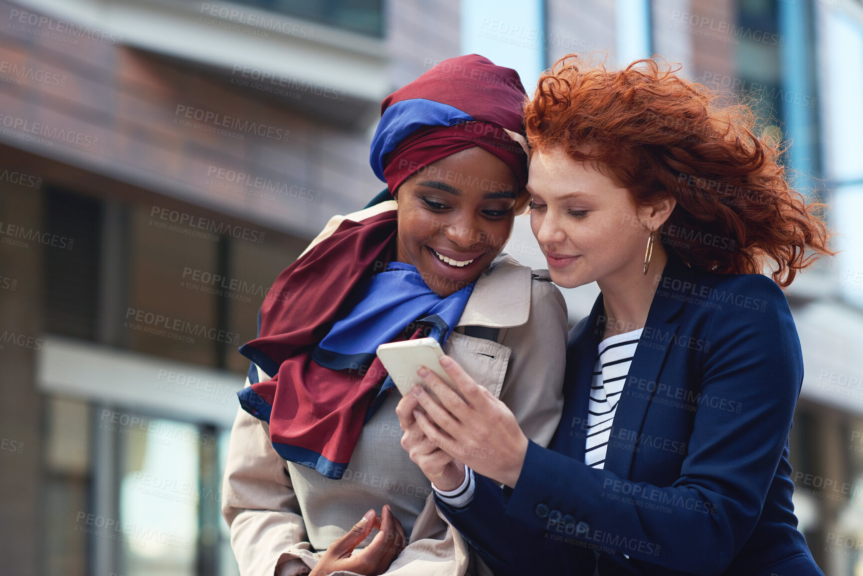 Buy stock photo Business women, phone and city travel with diversity while online for communication, gossip or news. Friends reading email on smartphone with 5g network or internet connection outdoor on urban street