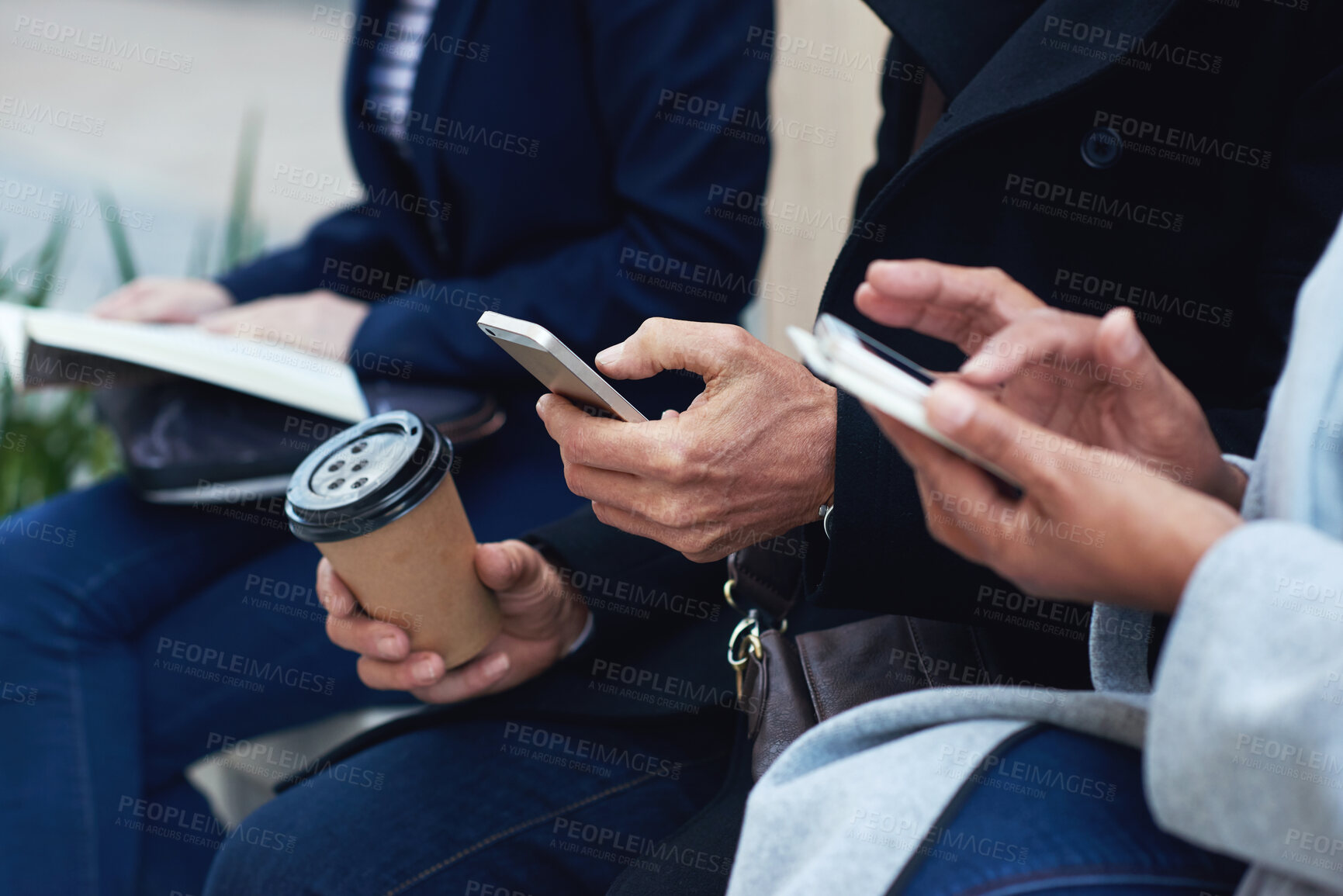 Buy stock photo Group hands, phone and coffee in communication, social media or networking for chatting or texting. Hand of people typing on smartphone in waiting room on mobile app or online browsing on technology