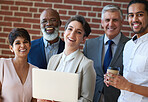 Portrait diverse business people smiling in office using laptop computer