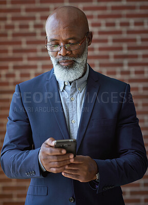 Buy stock photo Startup, black man and manager with smartphone, online reading and connection for typing. Mature male, African American employee or leader search internet, success or small business with entrepreneur