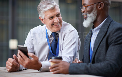 Buy stock photo Senior business people, laughing and phone in city, street or town while on social media. Technology, comic or happy men, friends or coworkers with 5g mobile to laugh at funny meme while web browsing