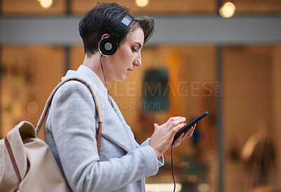 Buy stock photo Phone, music headphones and business woman in city streaming radio or podcast. Urban street, cellphone and female entrepreneur with 5g mobile smartphone for networking, social media or web browsing.