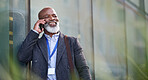African american businessman using smartphone talking on mobile phone call having conversation in city 