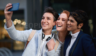 Buy stock photo Business people, smile and women take selfie in city for happy memory in town outdoors. Photographer, profile picture and group of friends or coworkers laughing and taking pictures for social media.