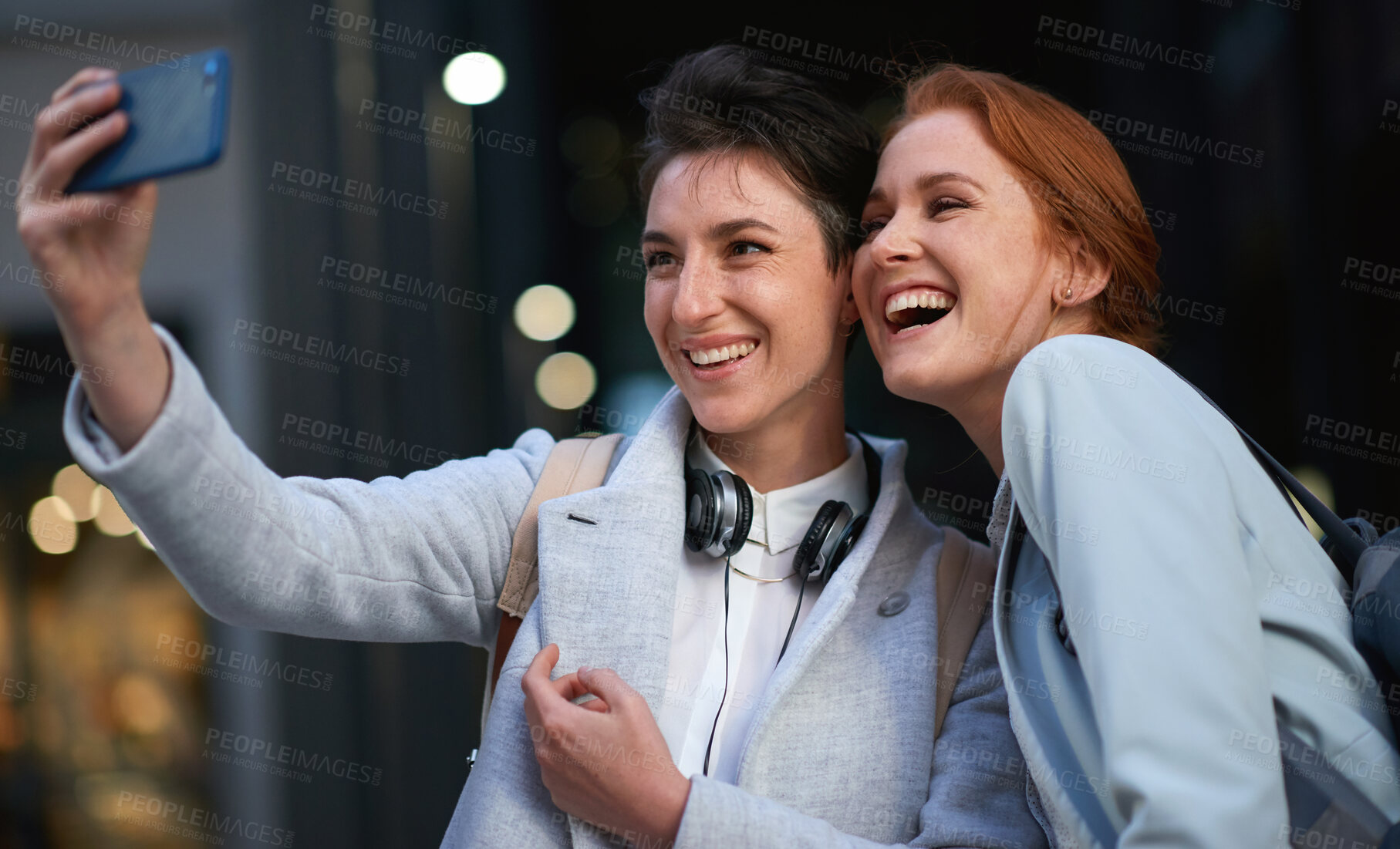 Buy stock photo Women, smile and business people take selfie in city for happy memory in street at night. Photographer, profile picture and friends or coworkers laughing at joke and taking pictures for social media.
