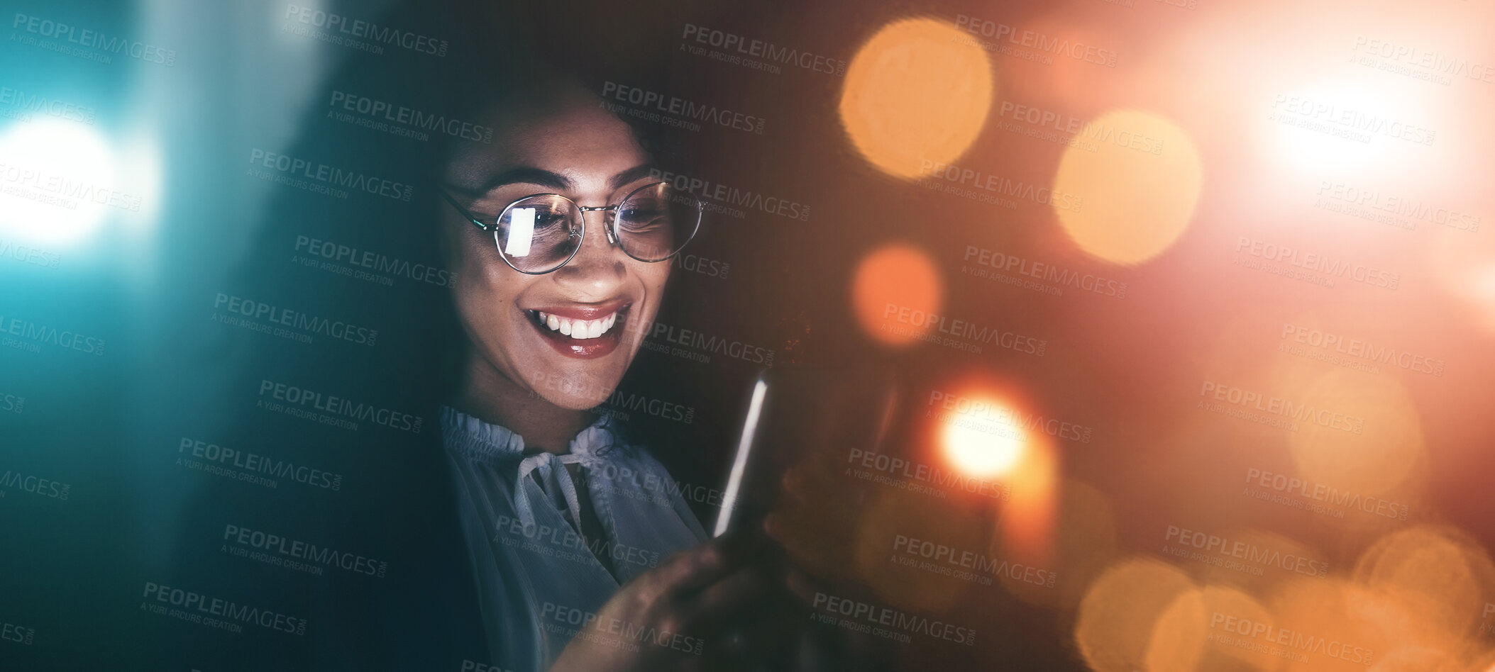 Buy stock photo Businesswoman, phone and smile in communication at night for texting, chatting or networking on dark background. Happy female employee holding smartphone working late for online planning strategy