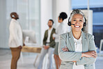 Senior woman, call center portrait and smile with arms crossed for teamwork, happiness and blurred background. Happy crm consultant, customer service expert or tech support leader in office at night
