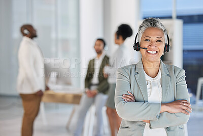 Buy stock photo Senior woman, call center portrait and smile with arms crossed, teamwork and happiness by blurred background. Happy crm consultant, customer service expert or tech support leader in office for vision