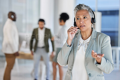 Buy stock photo Senior woman, call center and talk with manager, confused and question at customer service job. Crm expert, group and leader with consultation by blurred background for help, faq and telemarketing