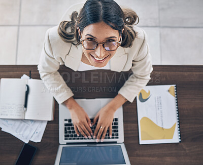 Buy stock photo Top view, portrait or business woman on laptop in company finance management, investment strategy or global financial growth. Smile, happy or worker typing on technology for budget planning or ideas