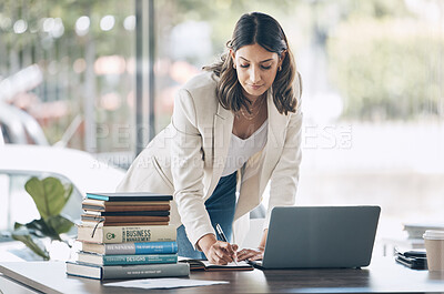 Buy stock photo Woman, serious or laptop for notebook writing, marketing strategy review or global planning schedule in office. Worker, employee or notes for technology startup, calendar management or growth goals