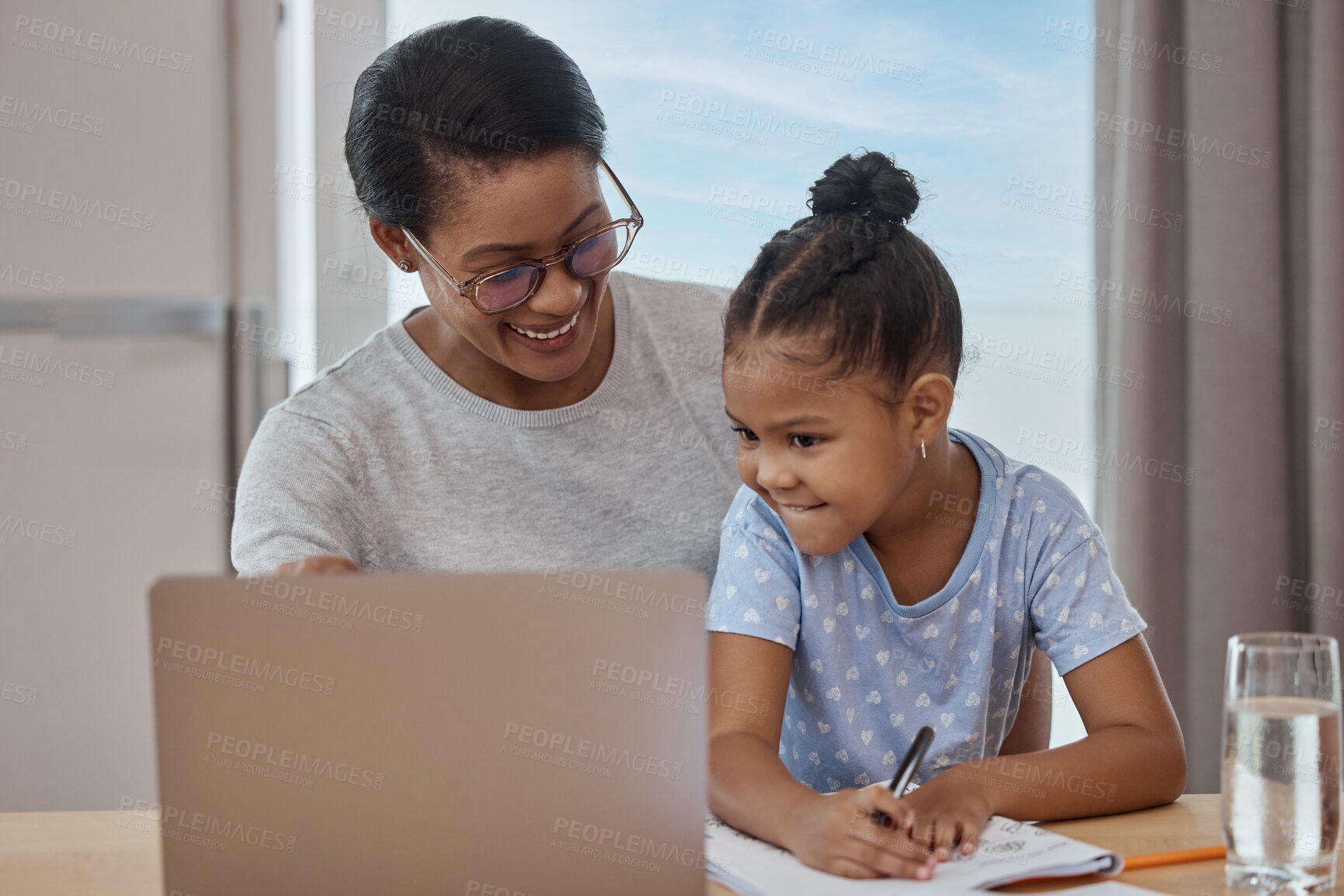 Buy stock photo Education, e learning and home school for girl with mother at a table for writing, lesson and online class. Distance learning, laptop and child student with mom in a living room, helping and bonding
