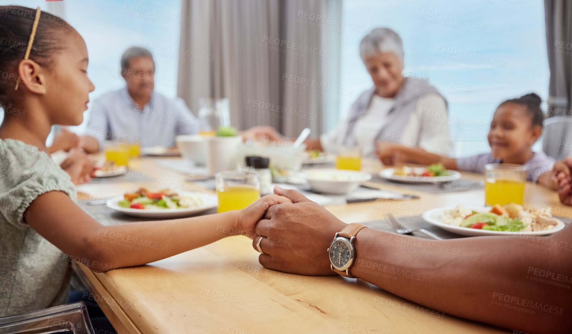 Buy stock photo Big family, dinner prayer and worship with holding hands before eating food at home. Children, grandparents and christian faith of kids praying with buffet gratitude at a table in a house with love