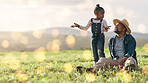 Bonding, relax and father and child on a field for playing, adventure and conversation in nature. Agriculture, communication and African dad talking to a playful girl on the grass in the countryside