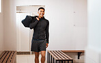 Sports, fitness and man in gym locker room with smile ready for game practice, exercise and training. Active lifestyle, sport club and male athlete with bag prepare for workout, wellness and health