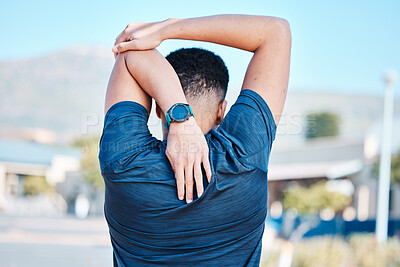 Buy stock photo Back of man, stretching and exercise in city for wellness, training and healthy lifestyle goals. Sports person warm up arms, body and outdoor workout for fitness, energy or marathon running in street