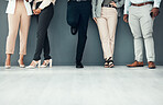 Legs, waiting room and group of people for interview, recruitment or job opportunity on wall background. Shoes, candidates and men with women on mockup for work hiring, process and company startup 