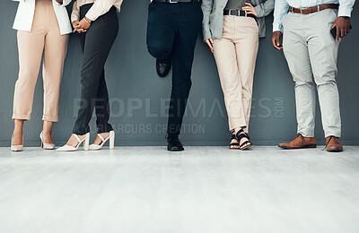 Buy stock photo Legs, waiting room and group of people for interview, recruitment or job opportunity on wall background. Shoes, candidates and men with women on mockup for work hiring, process and company startup 