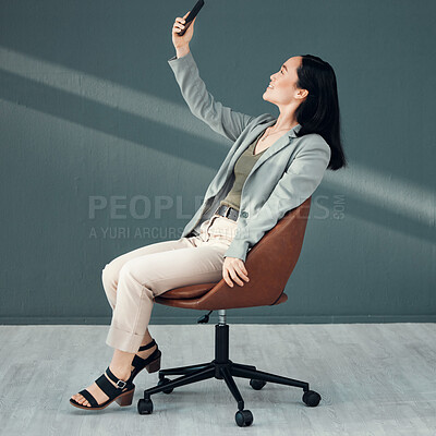 Buy stock photo Selfie, video call and woman with a phone for connection, internet and communication at work on a chair. Corporate and Asian employee reading an email, message or chat on a mobile app in an office