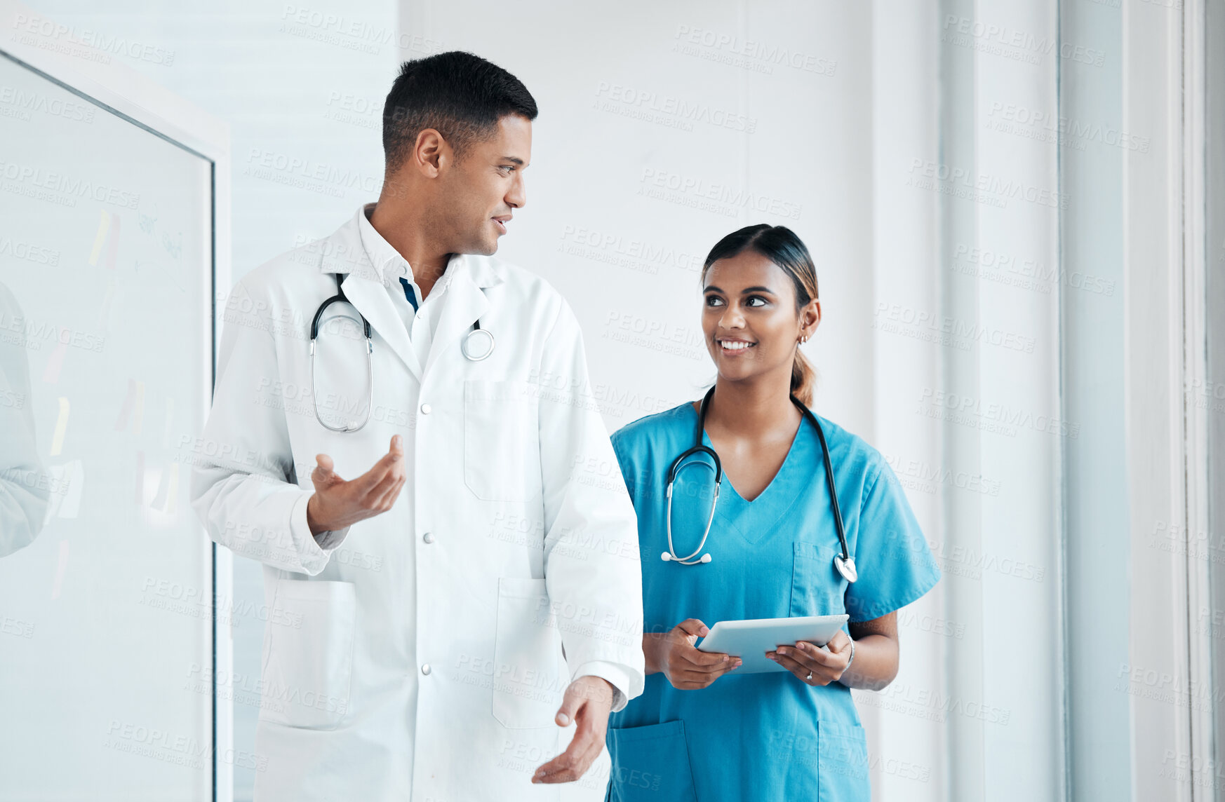 Buy stock photo Doctor, nurse and professionals walking, talking and planning healthcare surgery in a hospital together as medical experts. Medicine, tablet and colleagues in discussion as a team working in a clinic