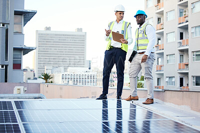 Buy stock photo Solar panels, rooftop and engineering people in energy saving, urban sustainability and city installation teamwork. Inspection, checklist and technician men planning sustainable power solution