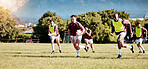 Game, sports and men playing rugby in a competition, match and running with a ball on a field. Fitness, exercise and players training for a team sport, cardio and collaboration in a park for practice