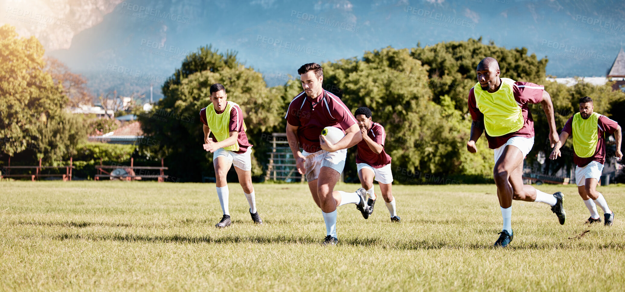 Buy stock photo Game, sports and men playing rugby in a competition, match and running with a ball on a field. Fitness, exercise and players training for a team sport, cardio and collaboration in a park for practice