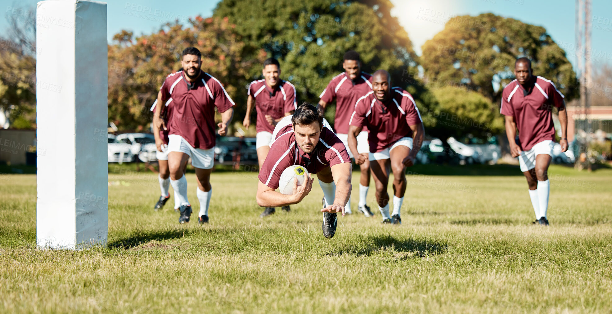 Buy stock photo Rugby, team on field and sports game with men, athlete running and player score a try with ball, fitness and active outdoor. Exercise, championship match and teamwork with jump, action and energy